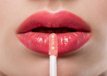 depositphotos_211060862-stock-photo-close-young-woman-applying-lip
